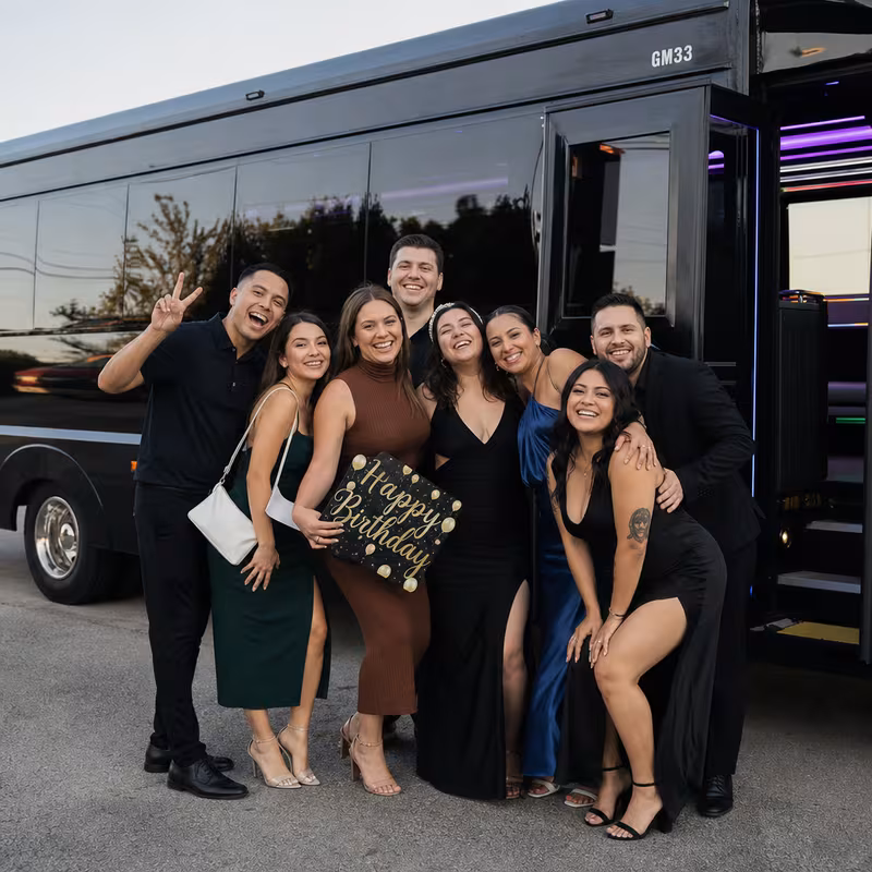 Party bus interior with wraparound leather seating and LED lighting in Atlanta