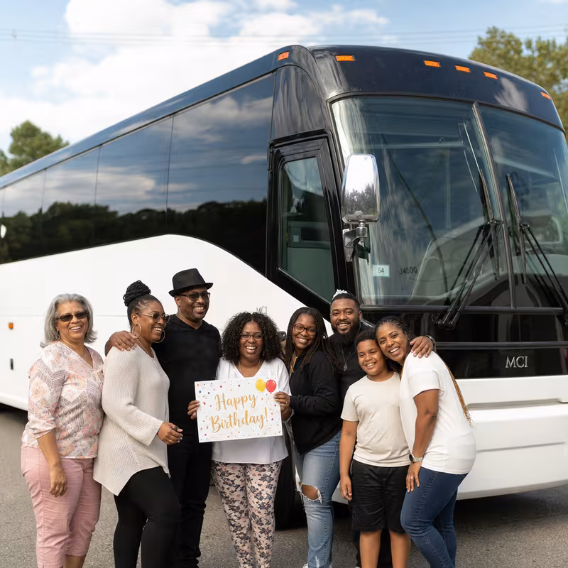 Passengers loading luggage while boarding an Atlanta group shuttle