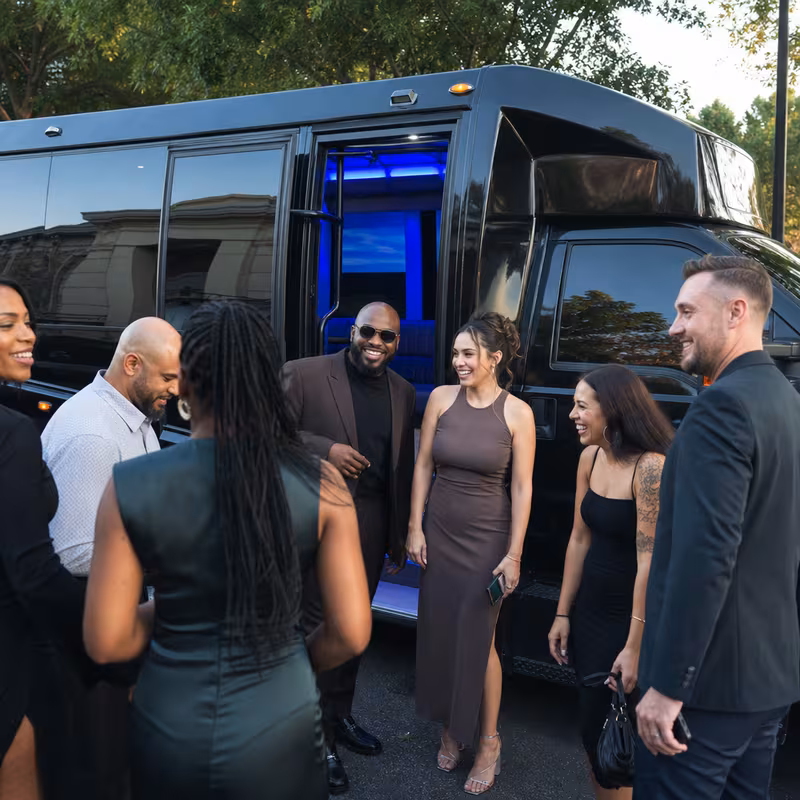 Passengers loading luggage while boarding an Atlanta group shuttle
