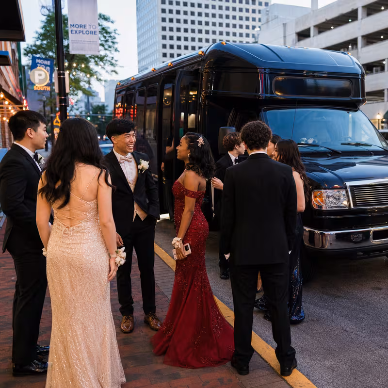 Passengers loading luggage while boarding an Atlanta group shuttle
