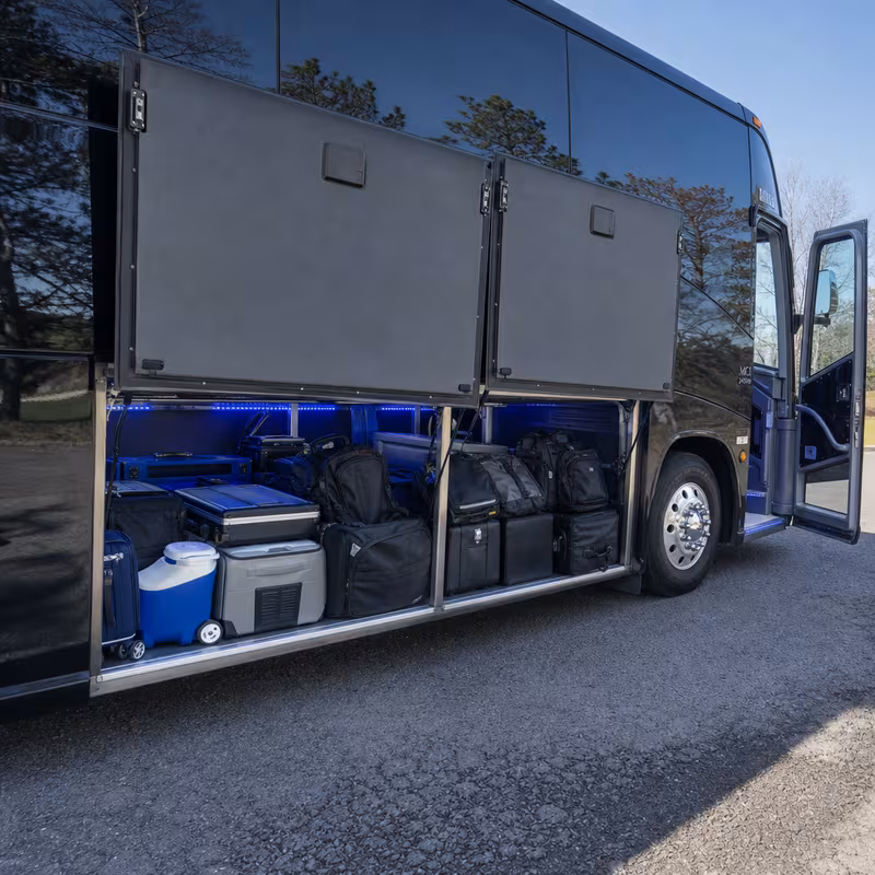 Party bus interior with wraparound leather seating and LED lighting in Atlanta