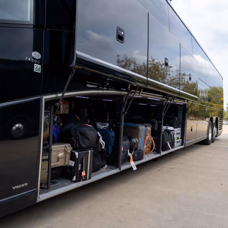 Party bus interior with wraparound leather seating and LED lighting in Atlanta
