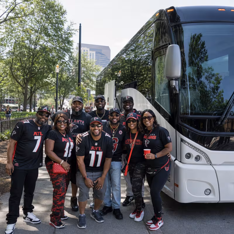 Passengers loading luggage while boarding an Atlanta group shuttle