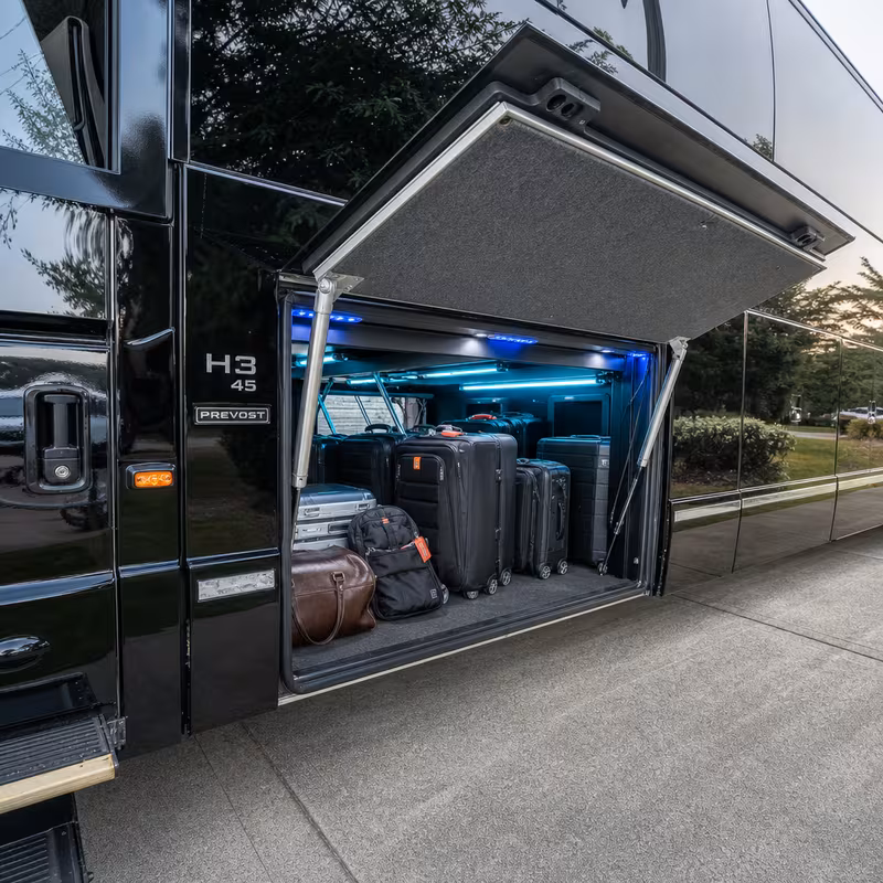 Party bus interior with wraparound leather seating and LED lighting in Atlanta