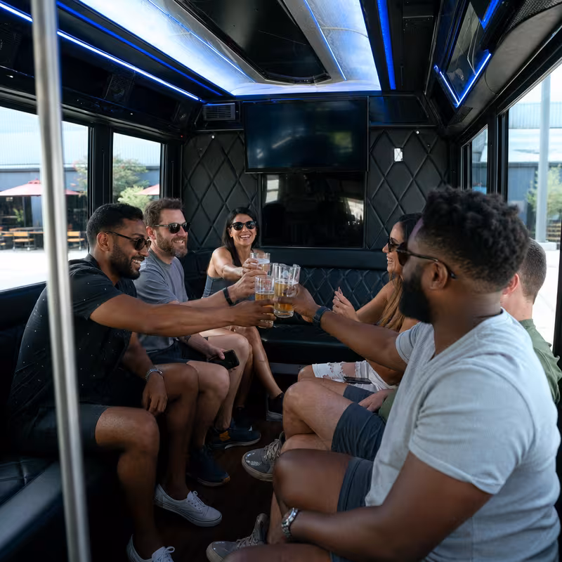 Group boarding a white charter bus for Winery & Brewery Tour Transportation transportation in Atlanta